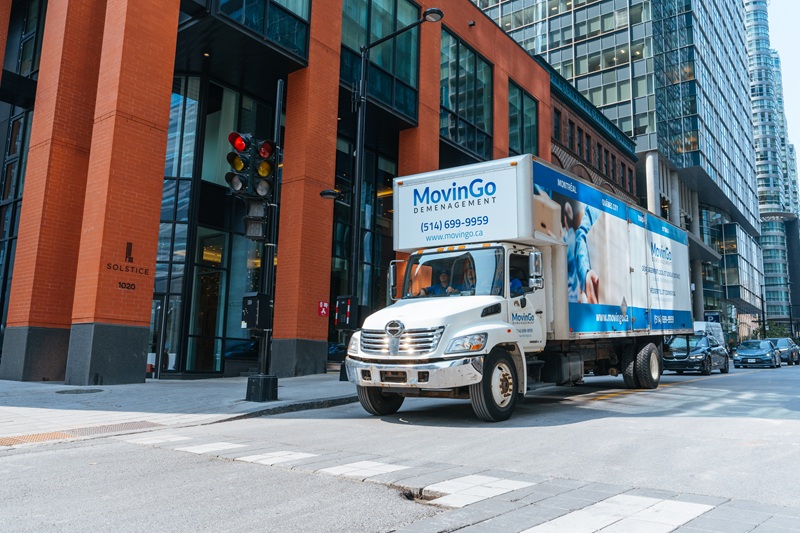 MovinGo moving truck on a downtown Montreal street